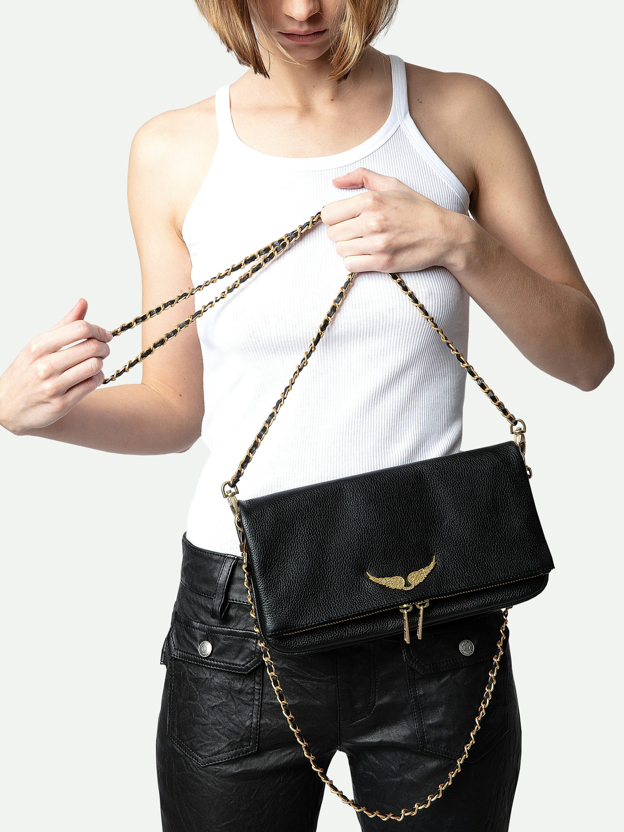 Rock Clutch - Grained leather clutch with double leather and metal chains and rhinestone-adorned wings.